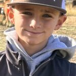 Young boy smiling supported by Give Hope Nevada program