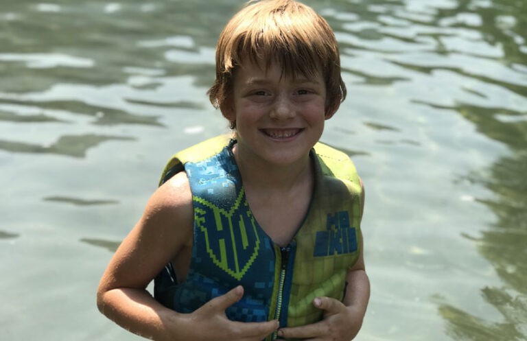 Child enjoying outdoor activity supported by nonprofit